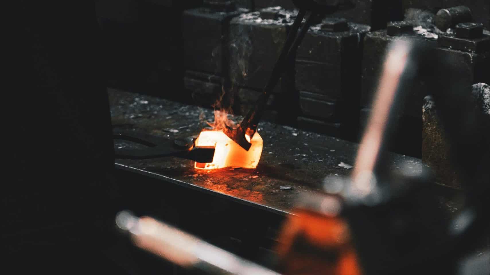 person holding forging tong