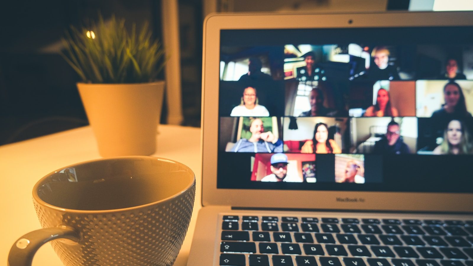 macbook air displaying woman in white shirt