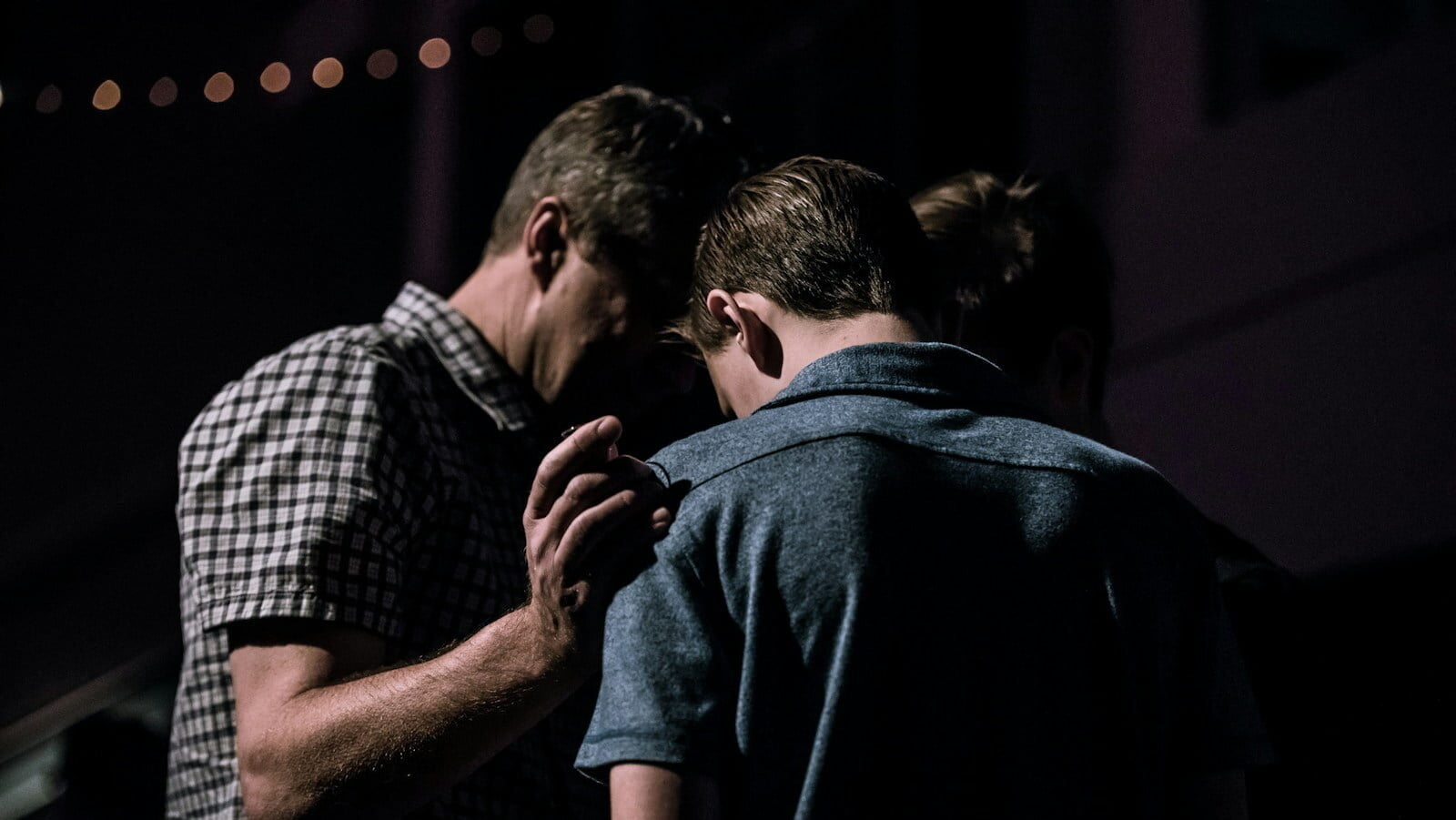 men touching each other's foreheads